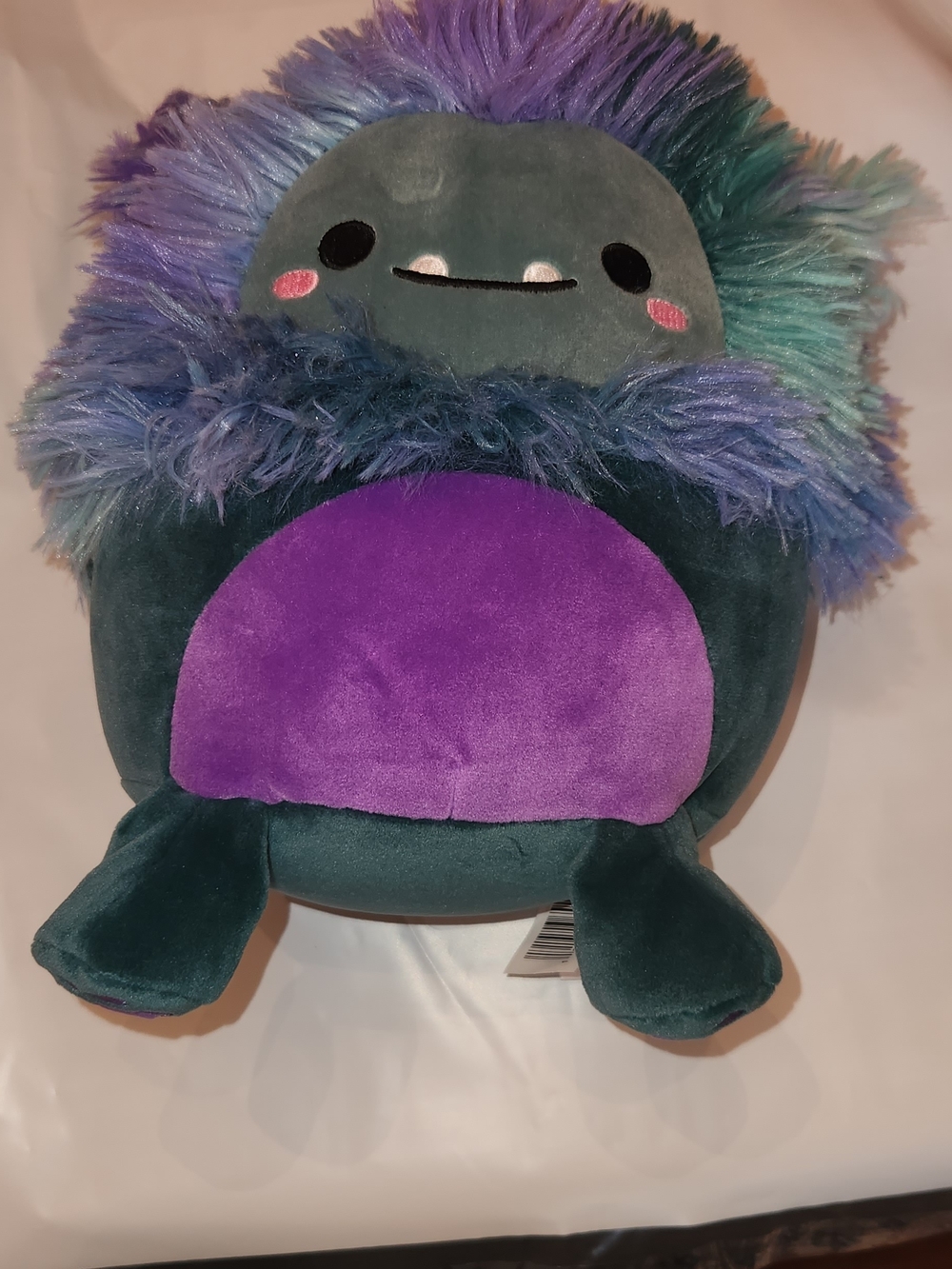 Squishmallows JT the Bigfoot Teal Plush with Purple Belly and Multicolor Mane